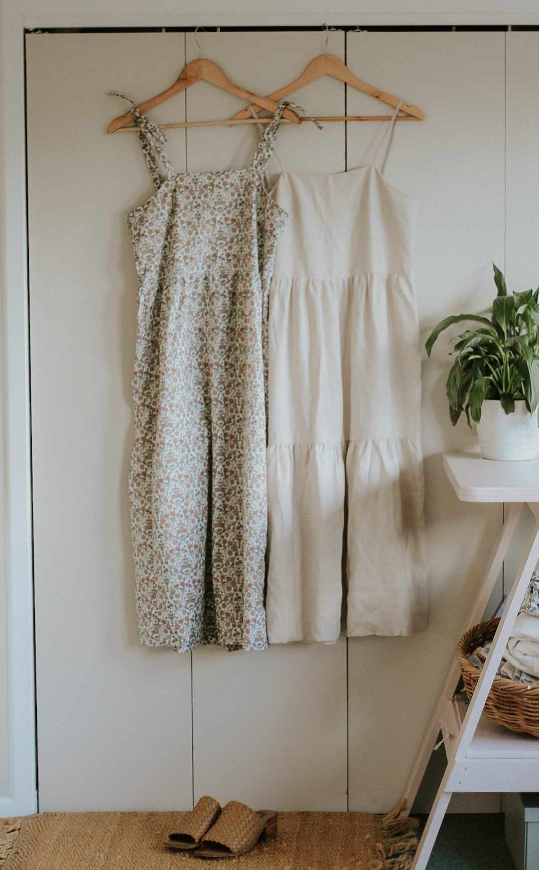 Tiered maxi dresses hanging on a wardrobe door