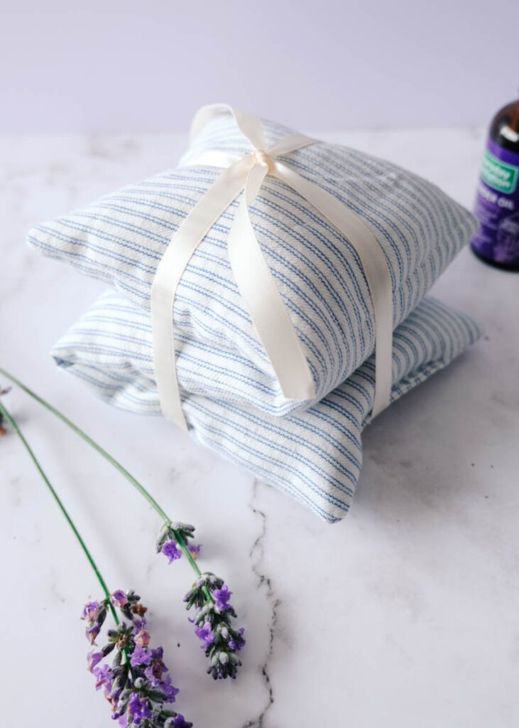 DIY heating pad for the microwave made from simple materials, cotton ticking, rice, and lavender essential oils.