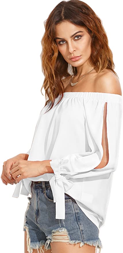 Woman wearing a white slit sleeve top with an off the shoulder neckline