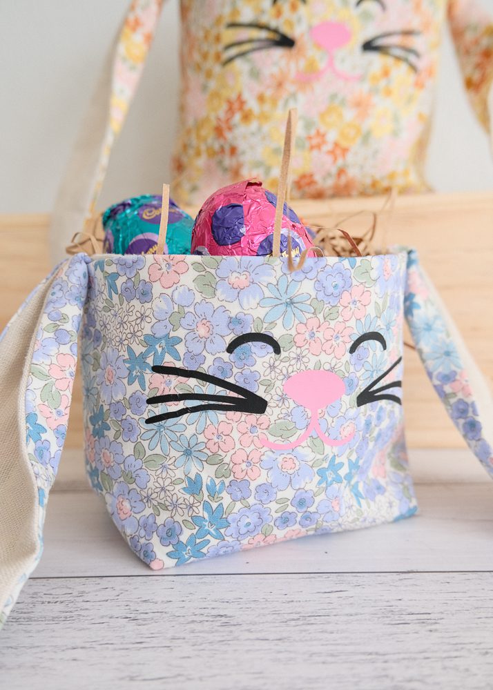Blue floral and linen easter bunny fabric basket with easter eggs inside
