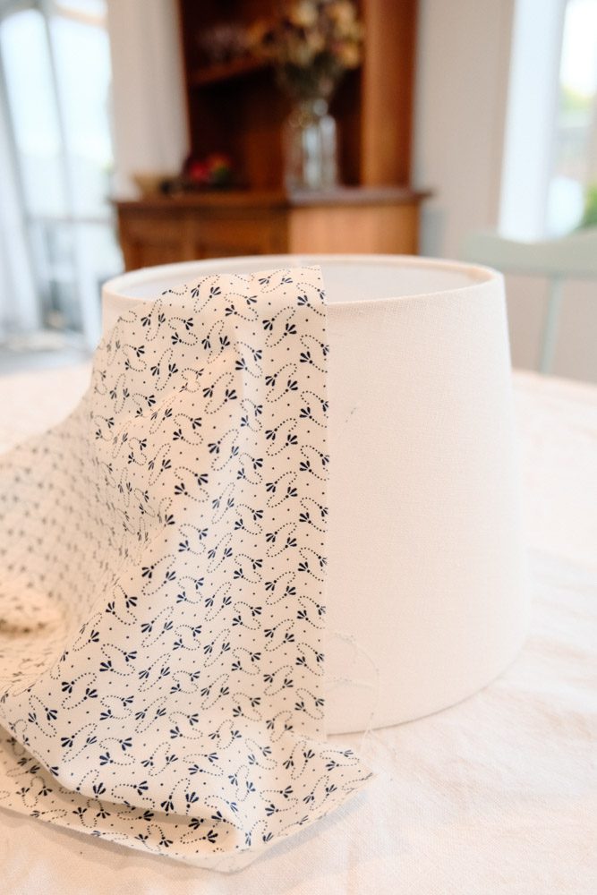 Close up of the lampshade with the fabric being attached to it