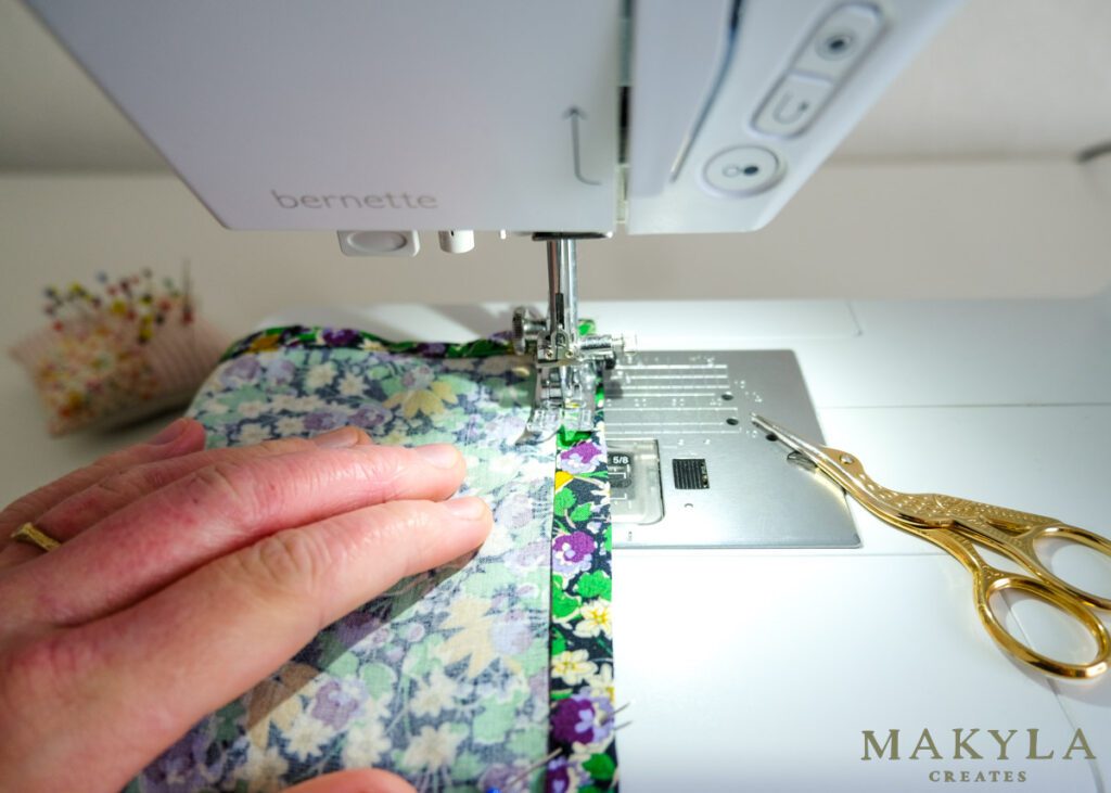 Makyla sewing the bandana hem