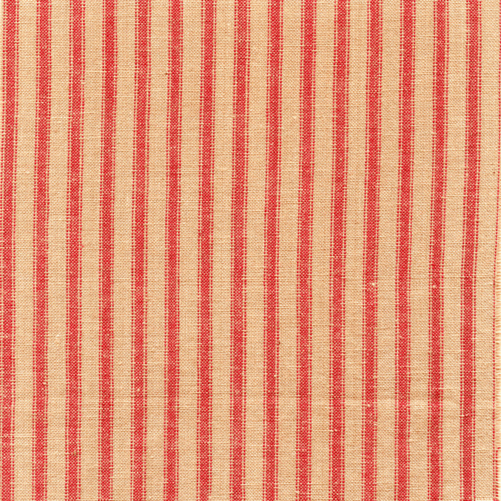 Close up image of ticking fabric in red and cream