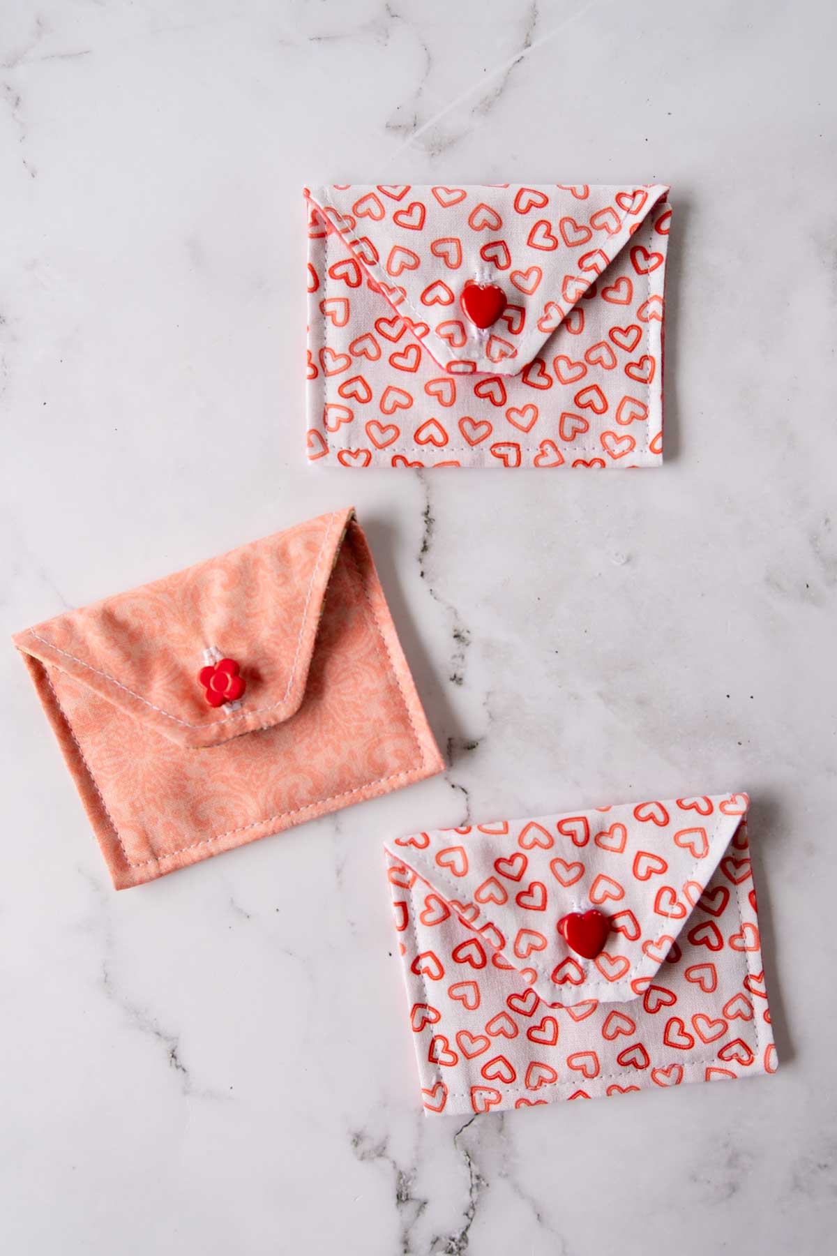 Three fabric envelopes in pretty Valentines Day fabrics