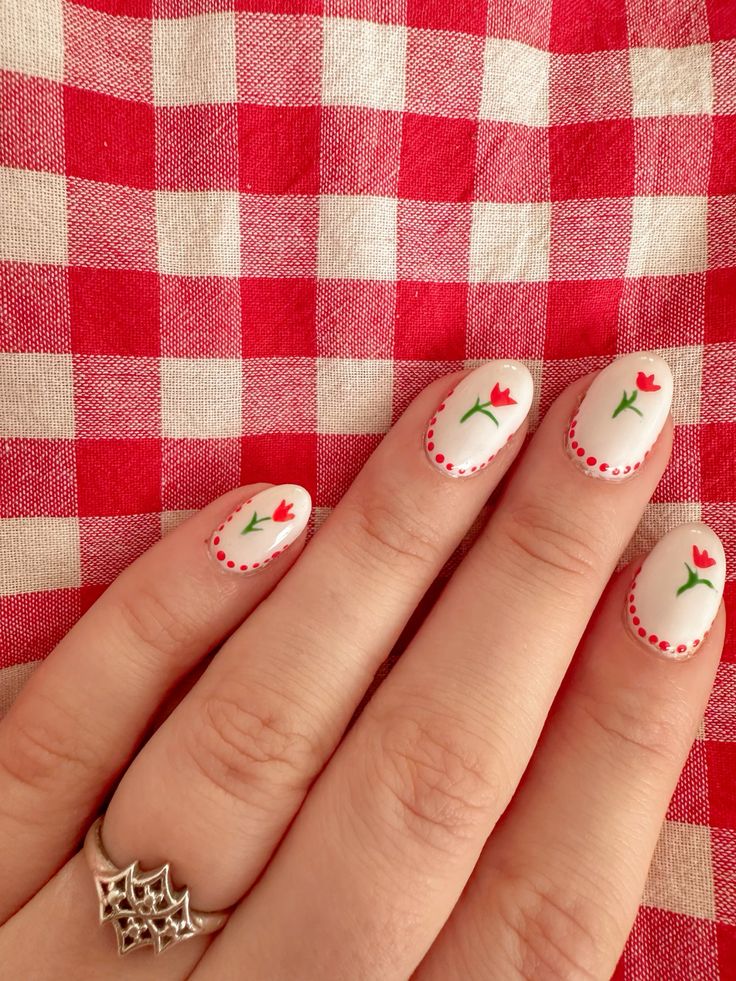White spring nails with red tulip art and dot border detail