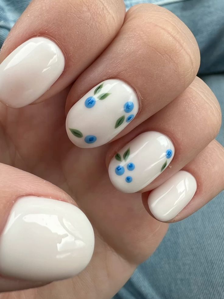 White spring nails with tiny blue forget-me-not floral art