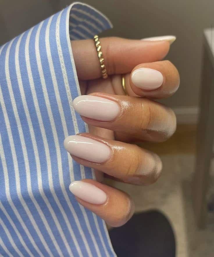 Almond-shaped nails in a creamy warm nude gel polish