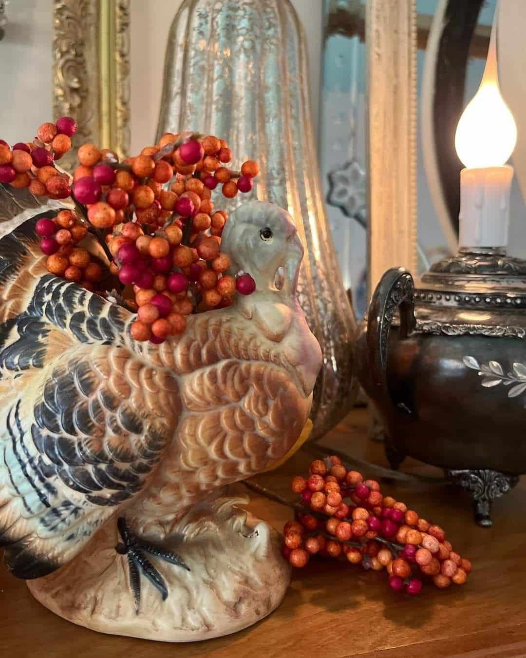 Vintage ceramic turkey figurine filled with fall berry sprigs