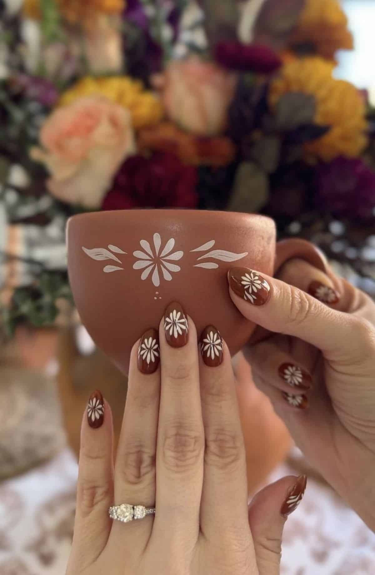 Chocolate brown nails with hand painted white daisies