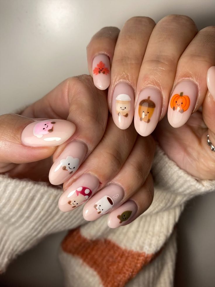 Cute autumn character nail art with pumpkins, acorns and mushrooms
