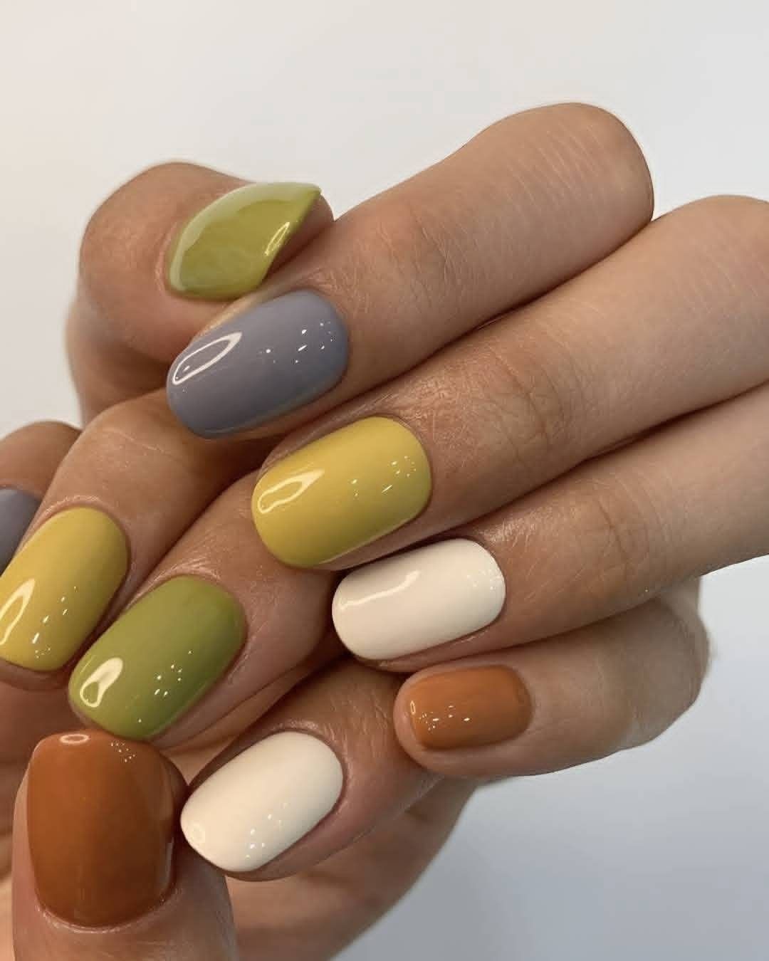 Bright autumn nail palette in chartreuse, grey, yellow and rust