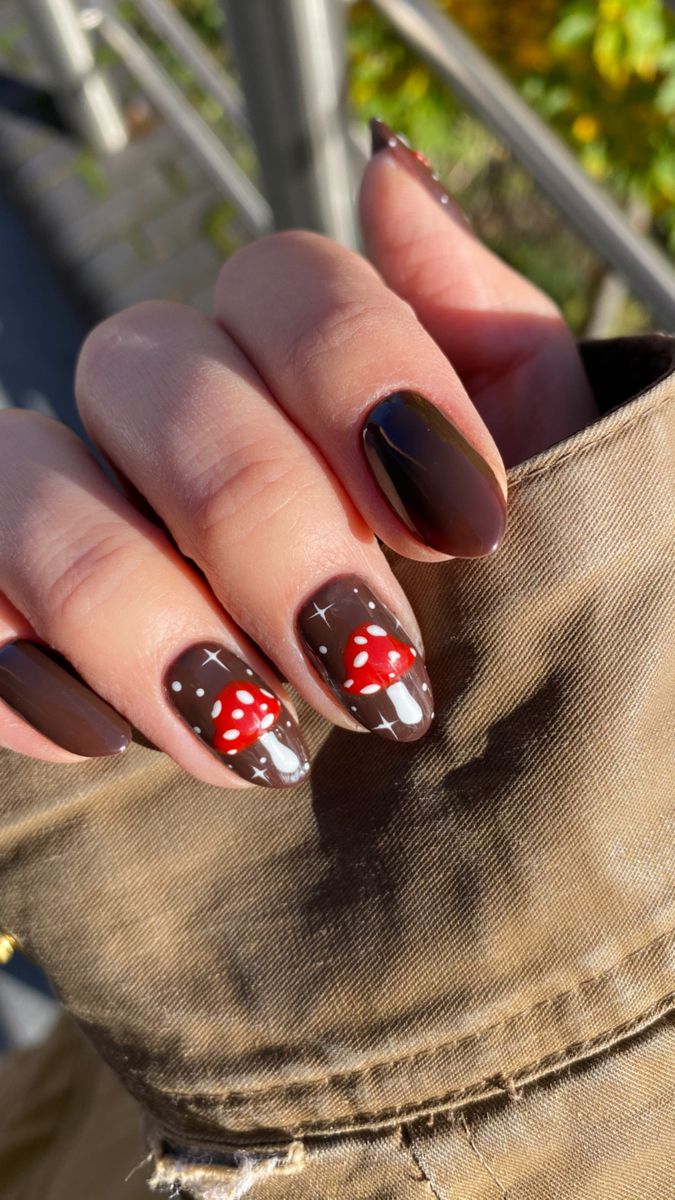 Chocolate brown nails with red toadstool mushroom accents