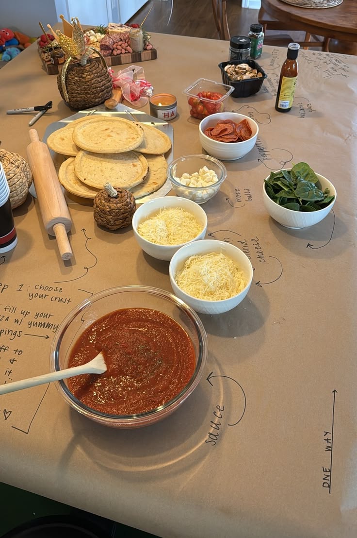 Tortilla base pizza station with steps written on a paper table liner