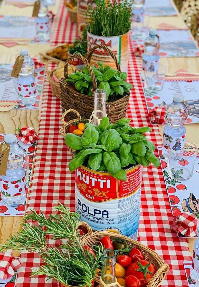 Italian market inspired tablescape with tomato cans planted with fresh basil