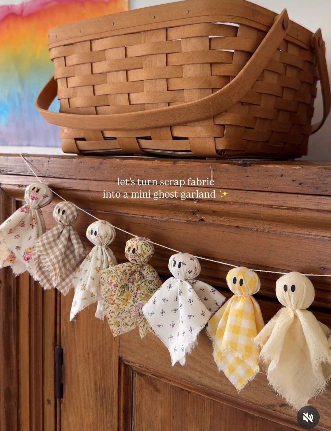 Garland of mini fabric ghosts knotted from floral and gingham fabric scraps