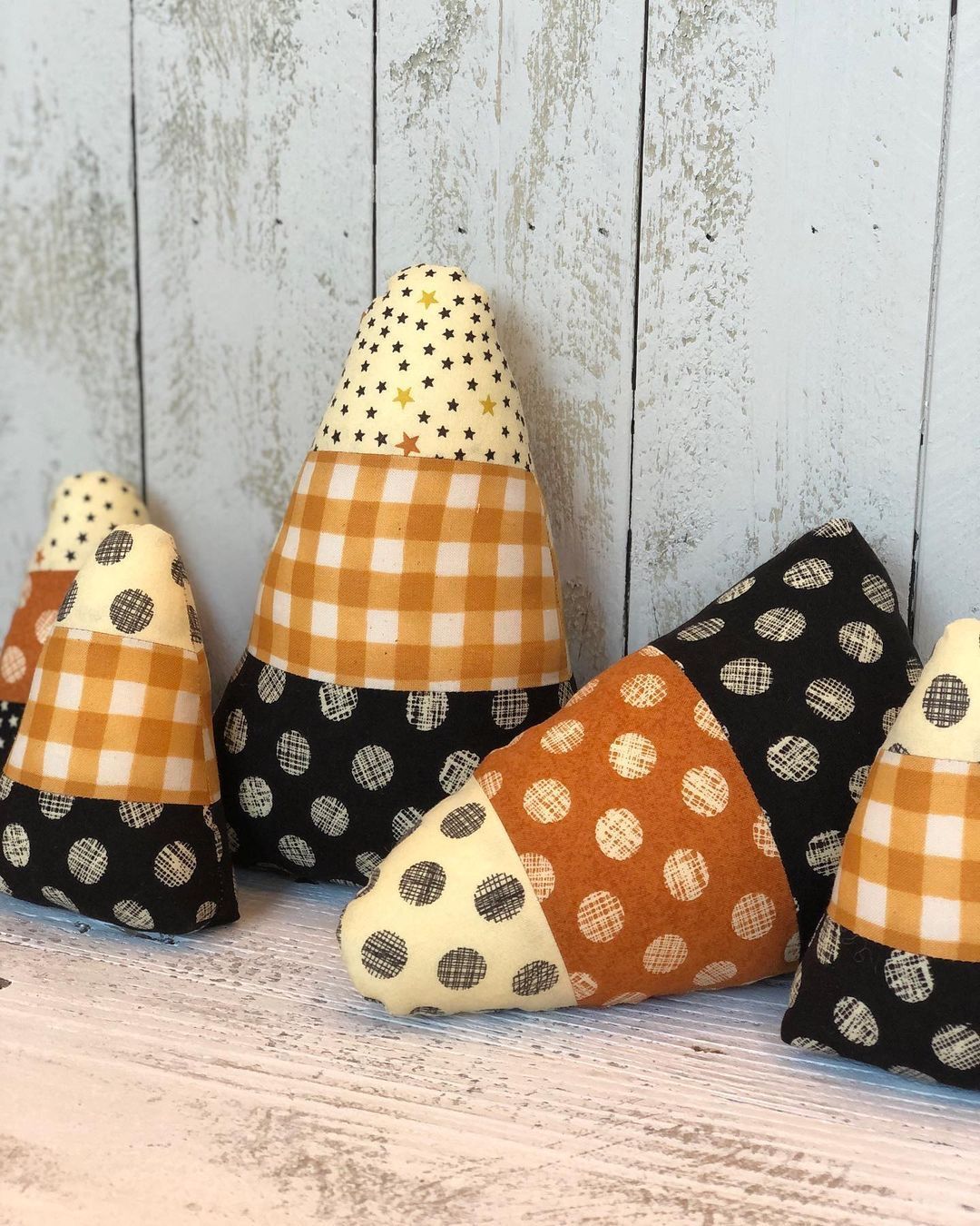 Stuffed patchwork candy corn softies in gingham, polka dot and star prints