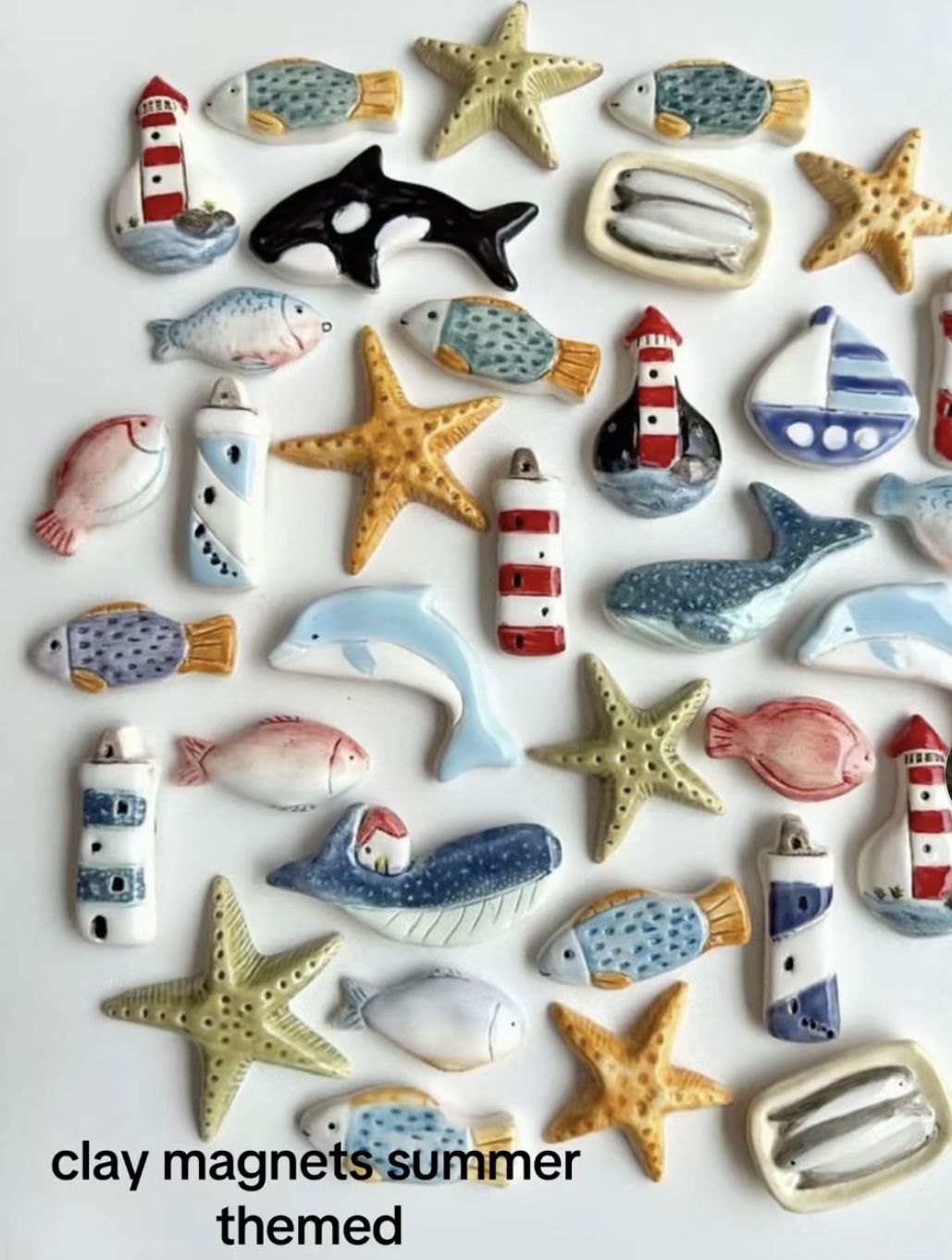 Coastal clay magnets with a soft ceramic finish including fish, starfish, lighthouses and sailboats