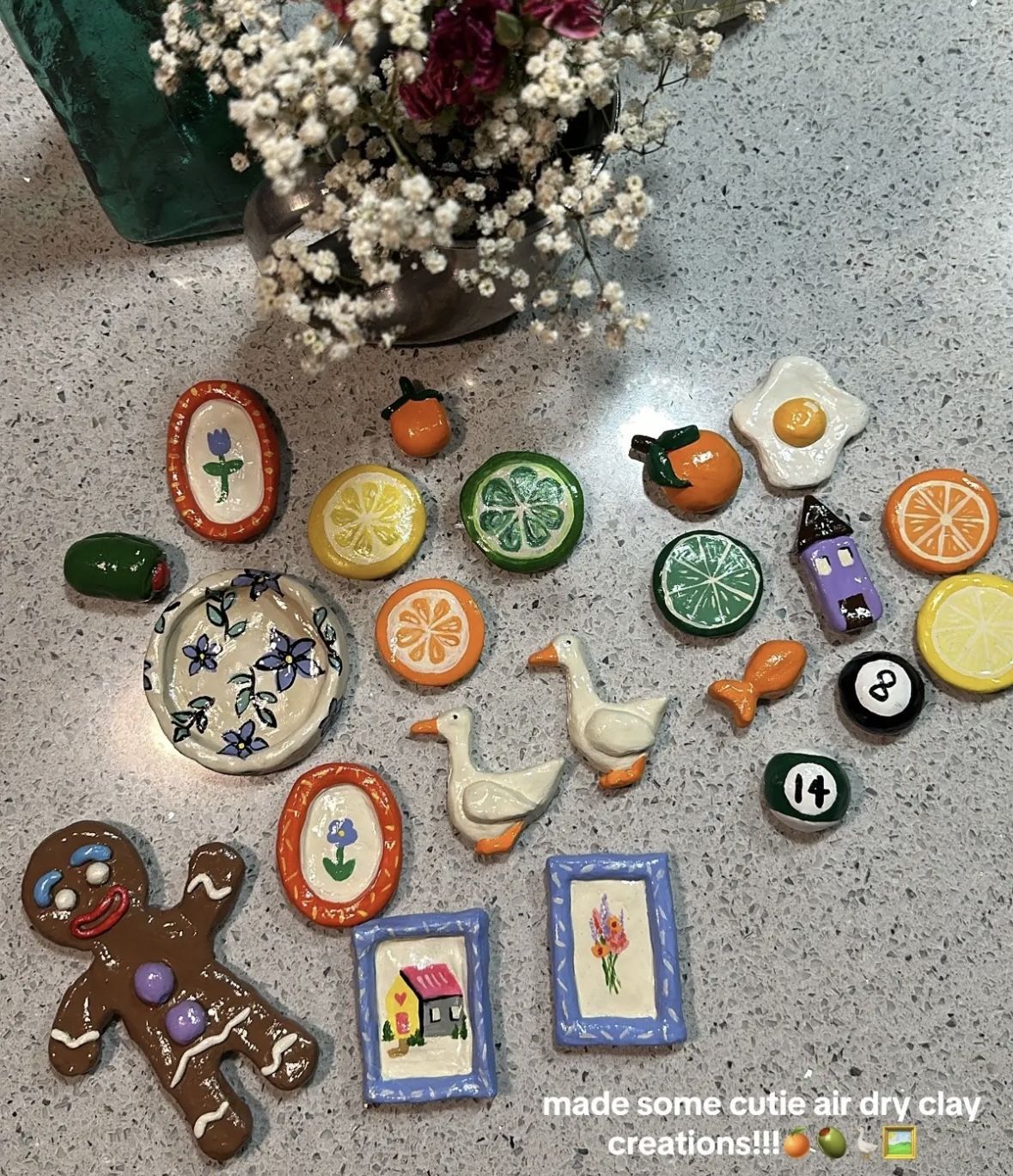 Hand-painted air-dry clay magnets including citrus slices, geese and small framed flower and house paintings