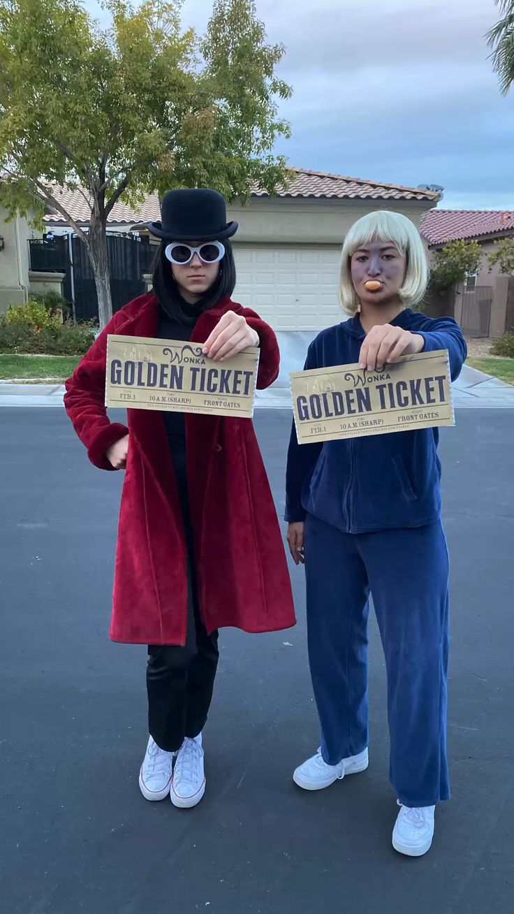 One person as Willy Wonka in a red coat and top hat beside another as blueberry Violet, both holding golden tickets