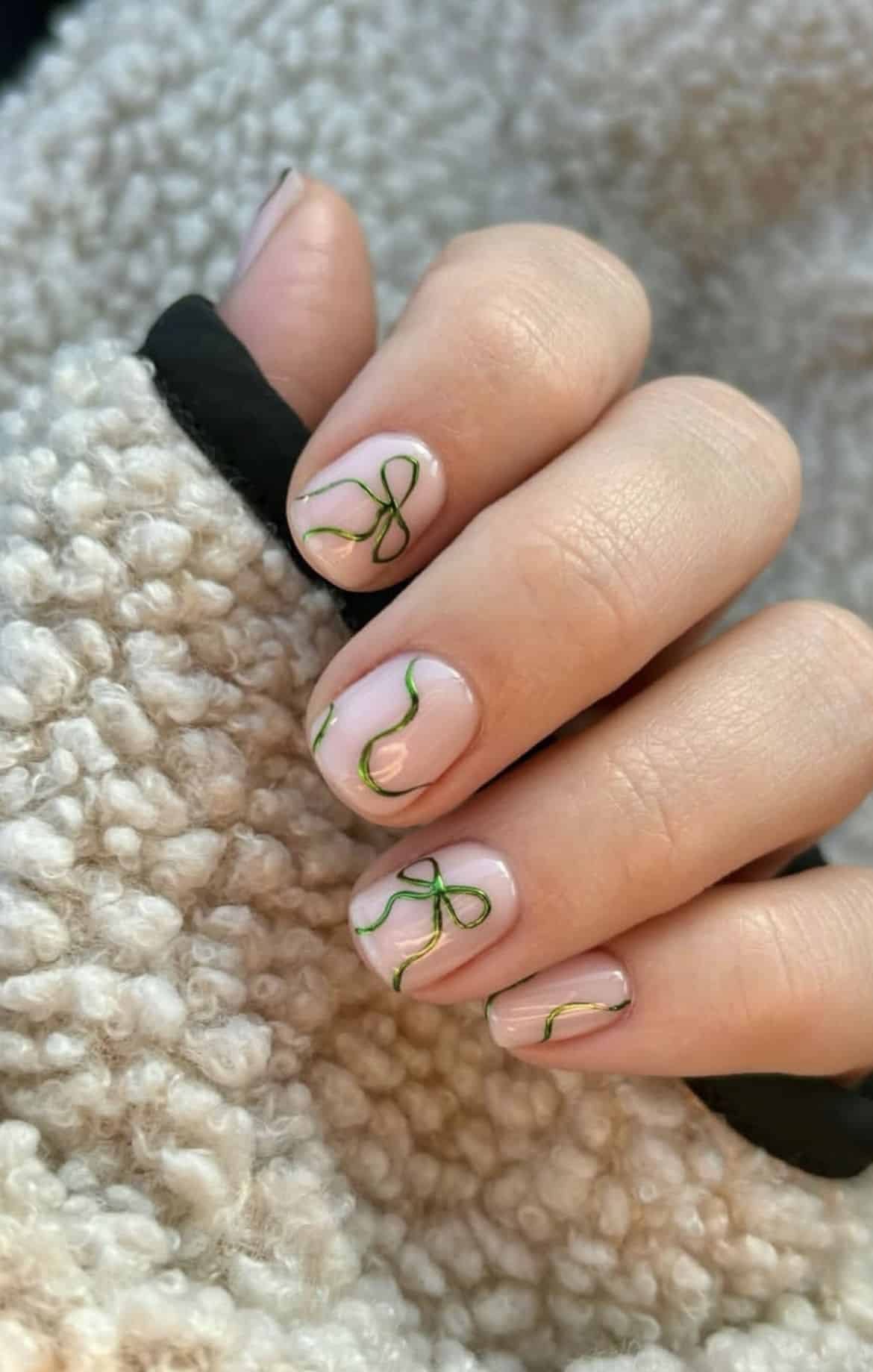 Short sheer Christmas nails with green chrome ribbons and bows