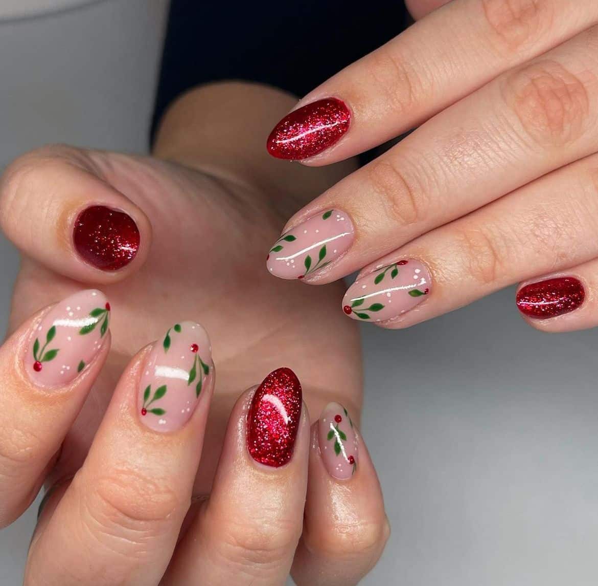 Red glitter Christmas nails with hand painted holly and berries