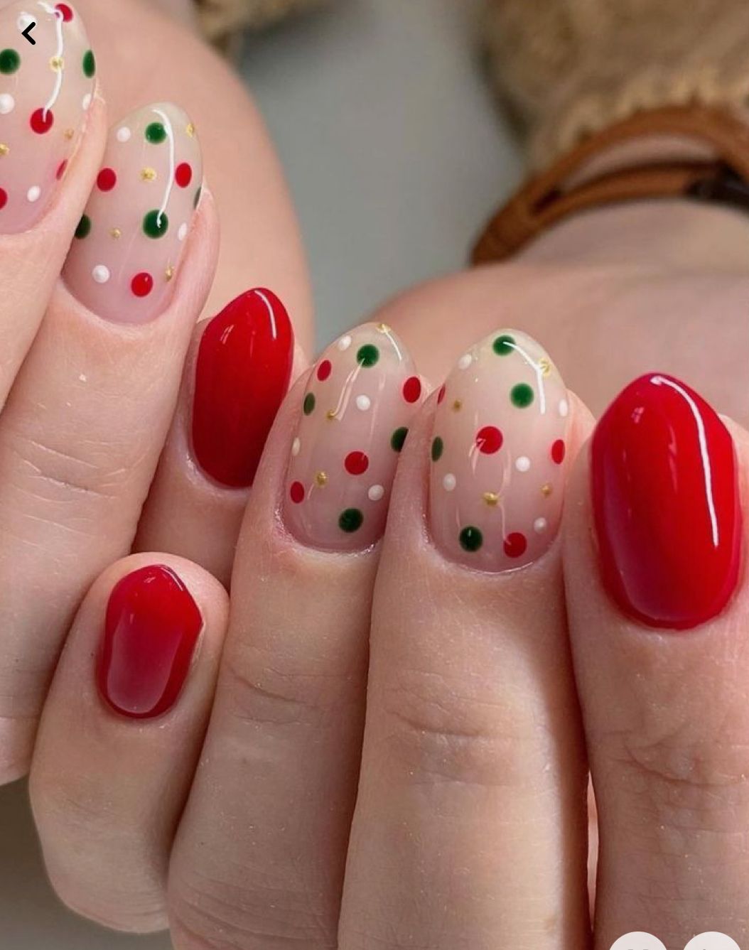 Red and nude Christmas nails with red, green, white and gold polka dots