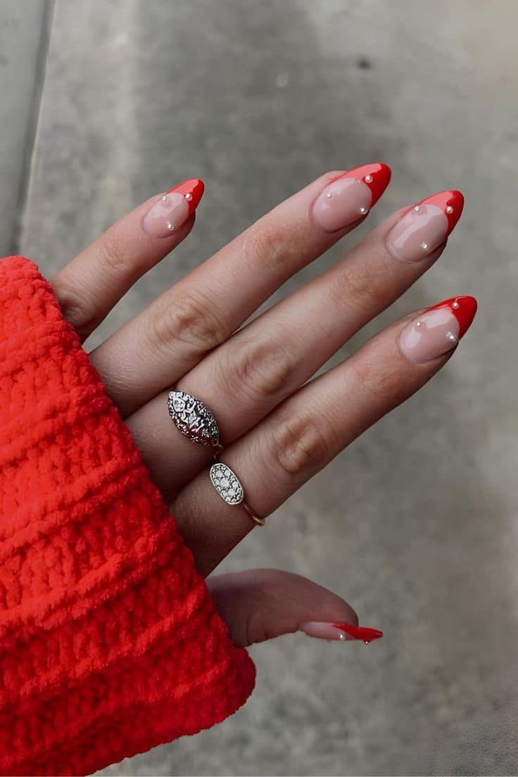 Red French tip Christmas nails with tiny pearl details