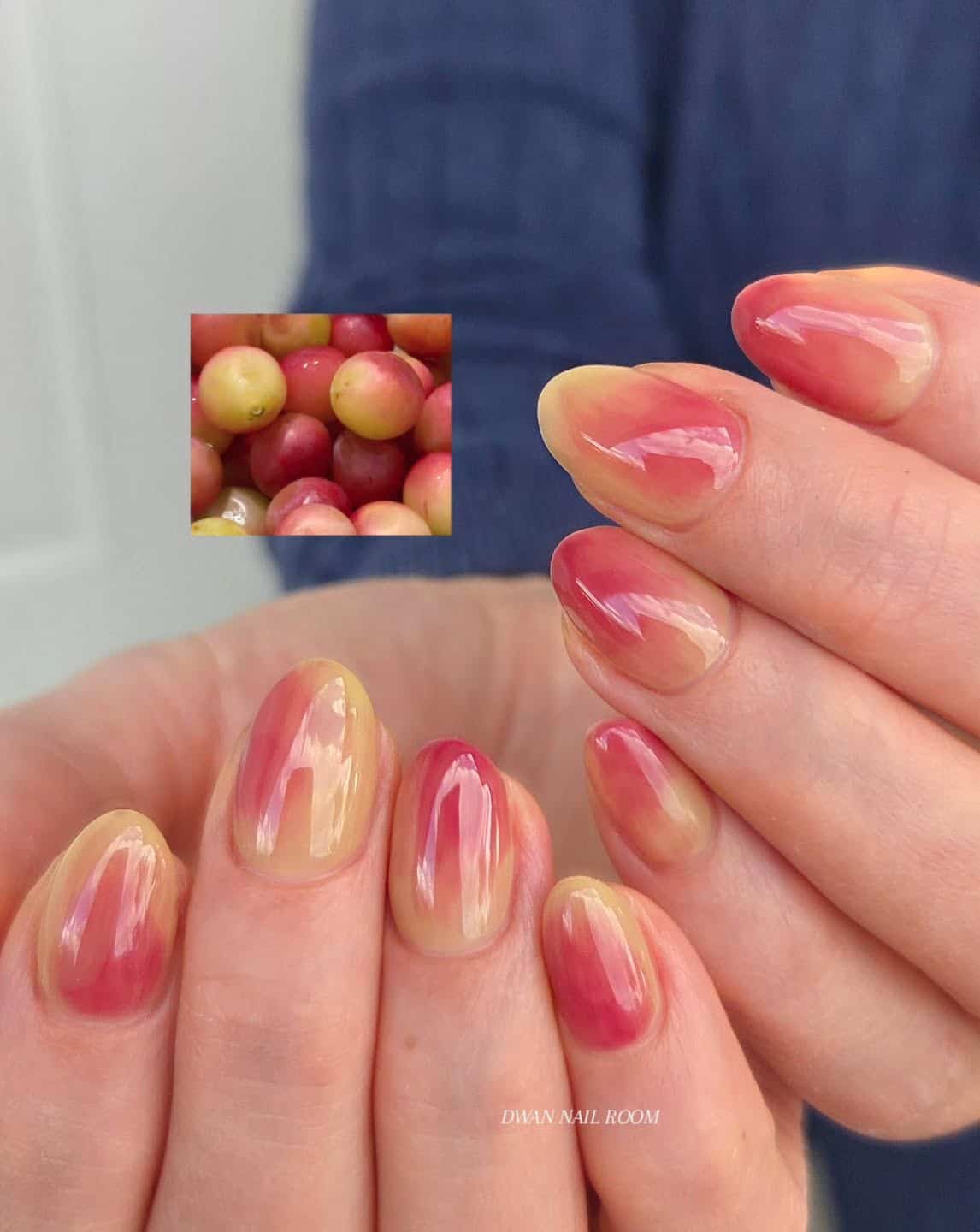 Short almond nails with a pinky red and yellow green grape inspired aura blush