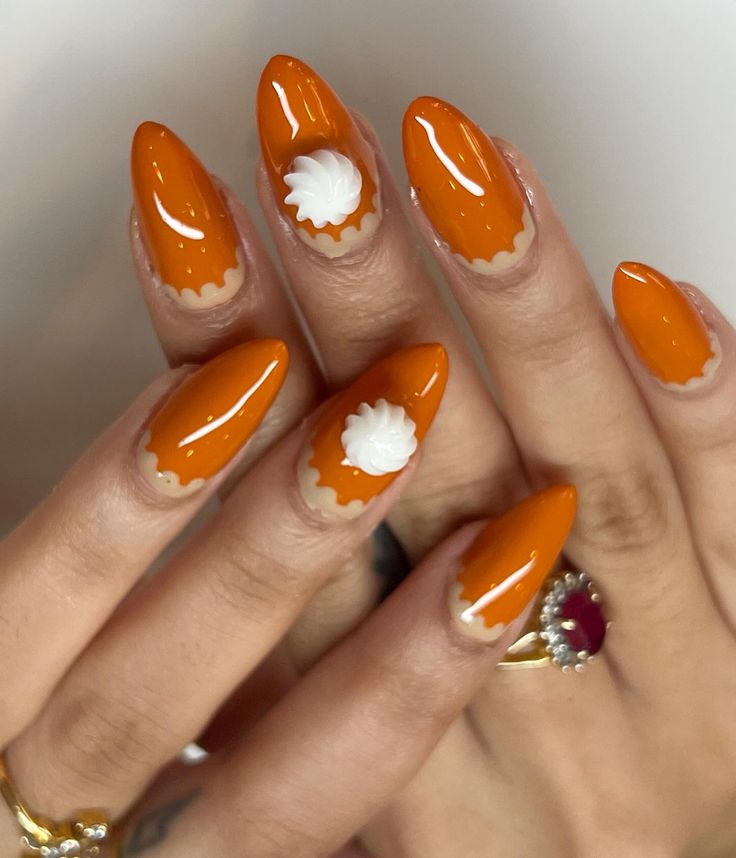 Long almond pumpkin pie nails in orange with a scalloped cream crust edge and 3D whipped cream accents